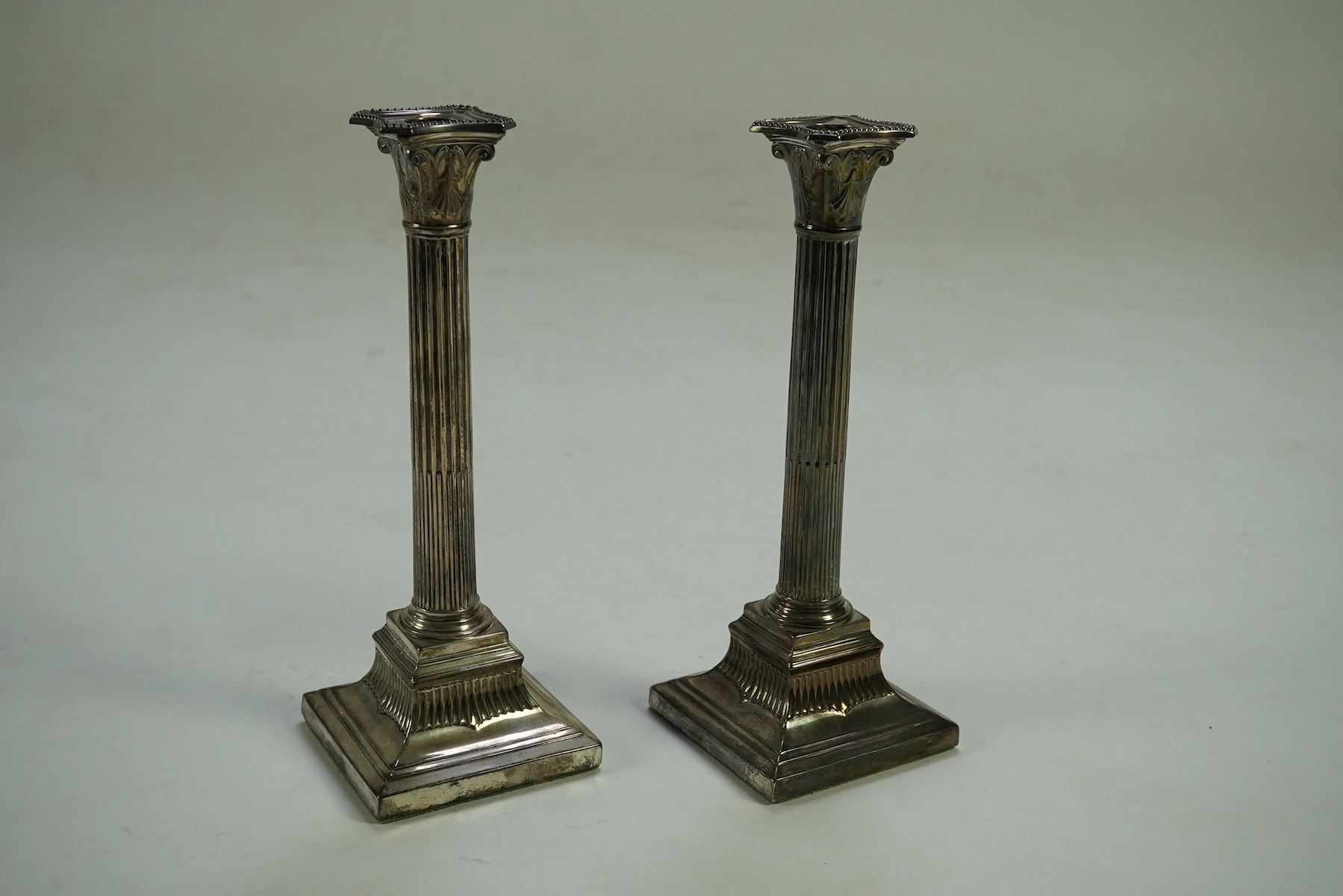 A pair of Victorian silver fluted column candlesticks, by Thomas Bradbury & Sons